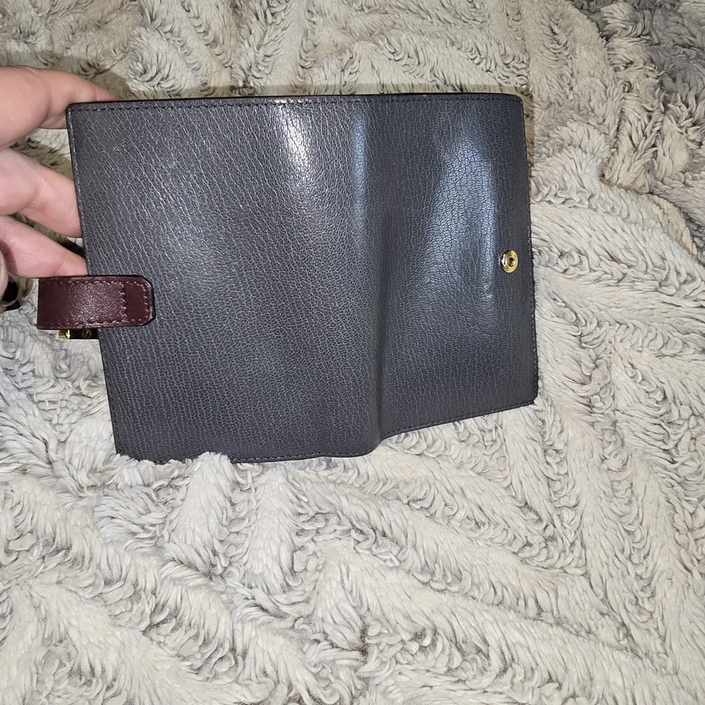 Classic Black Leather Wallet with Brown Accent and Gold Hardware
